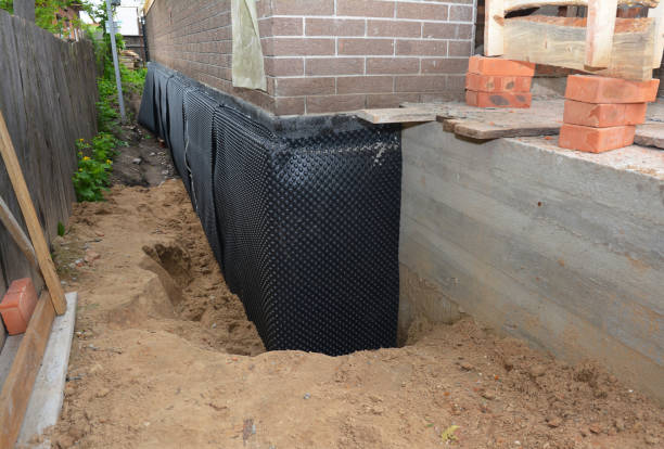 SJ Waterproofing Pros technician performing targeted Vapor Barrier Installation assessment in Bolingbrook, IL